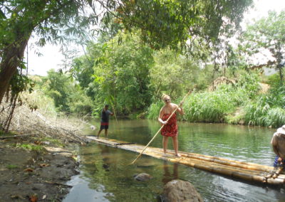 Rowing a bamboo raft